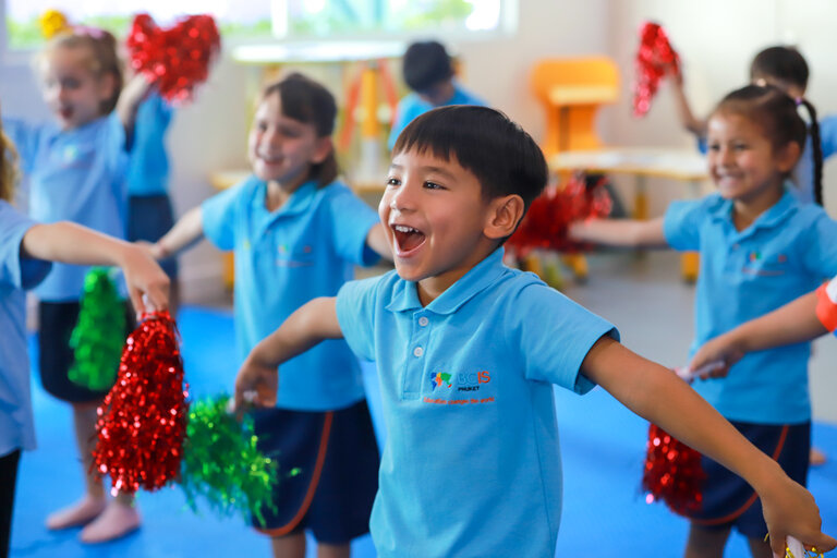BCIS student smiling and dancing
