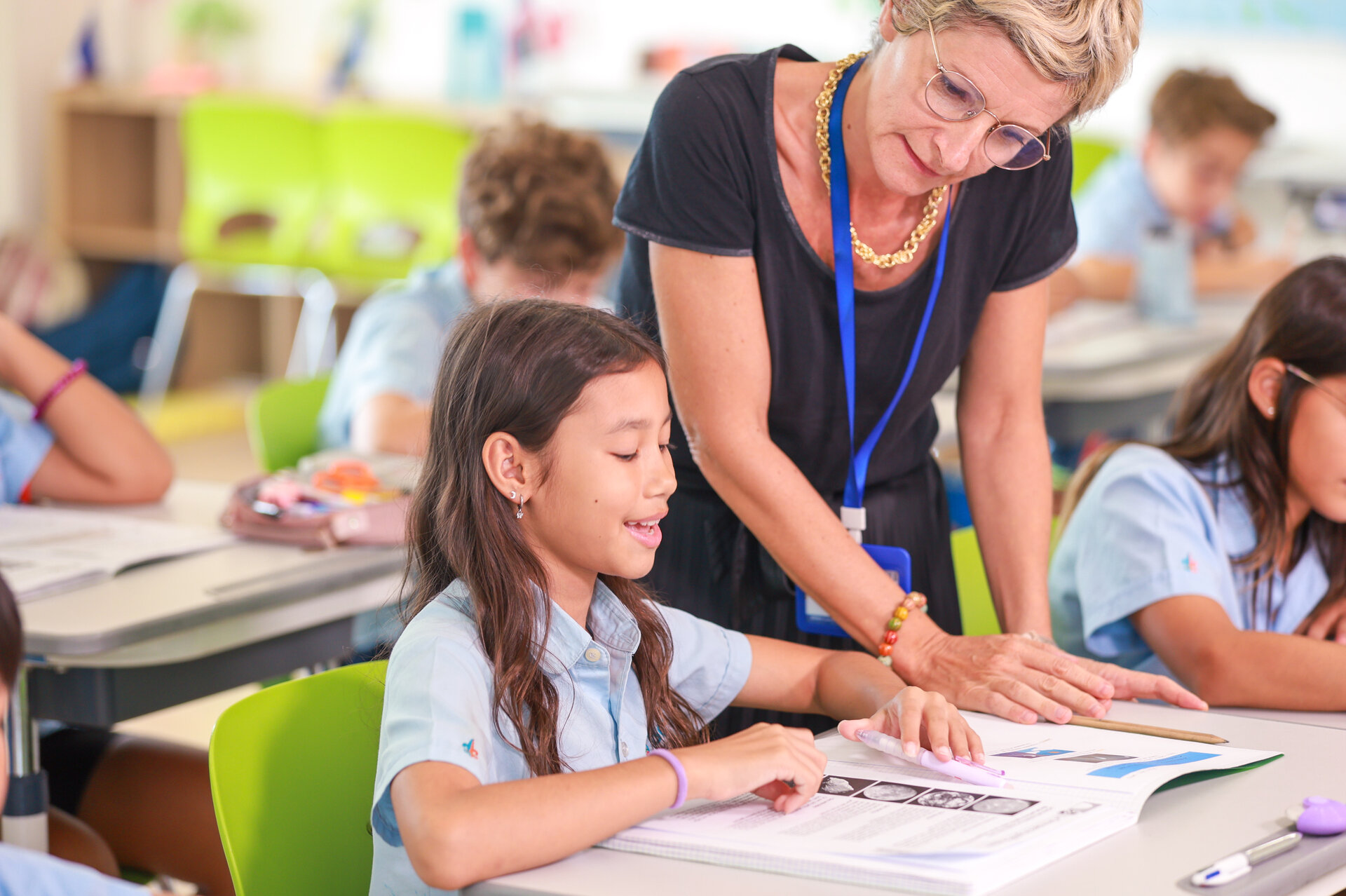 student reading with the teacher