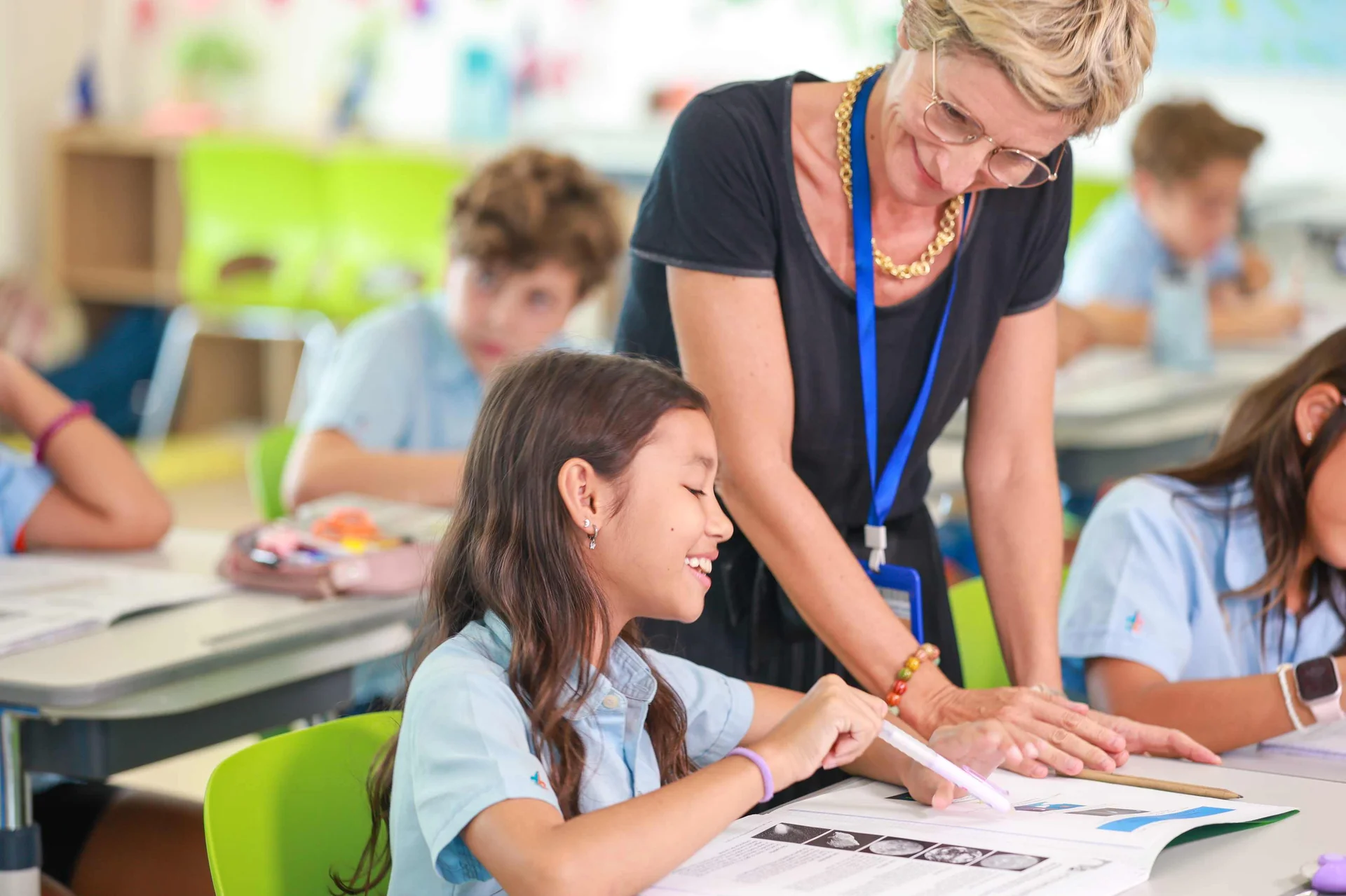 student reading with the teacher