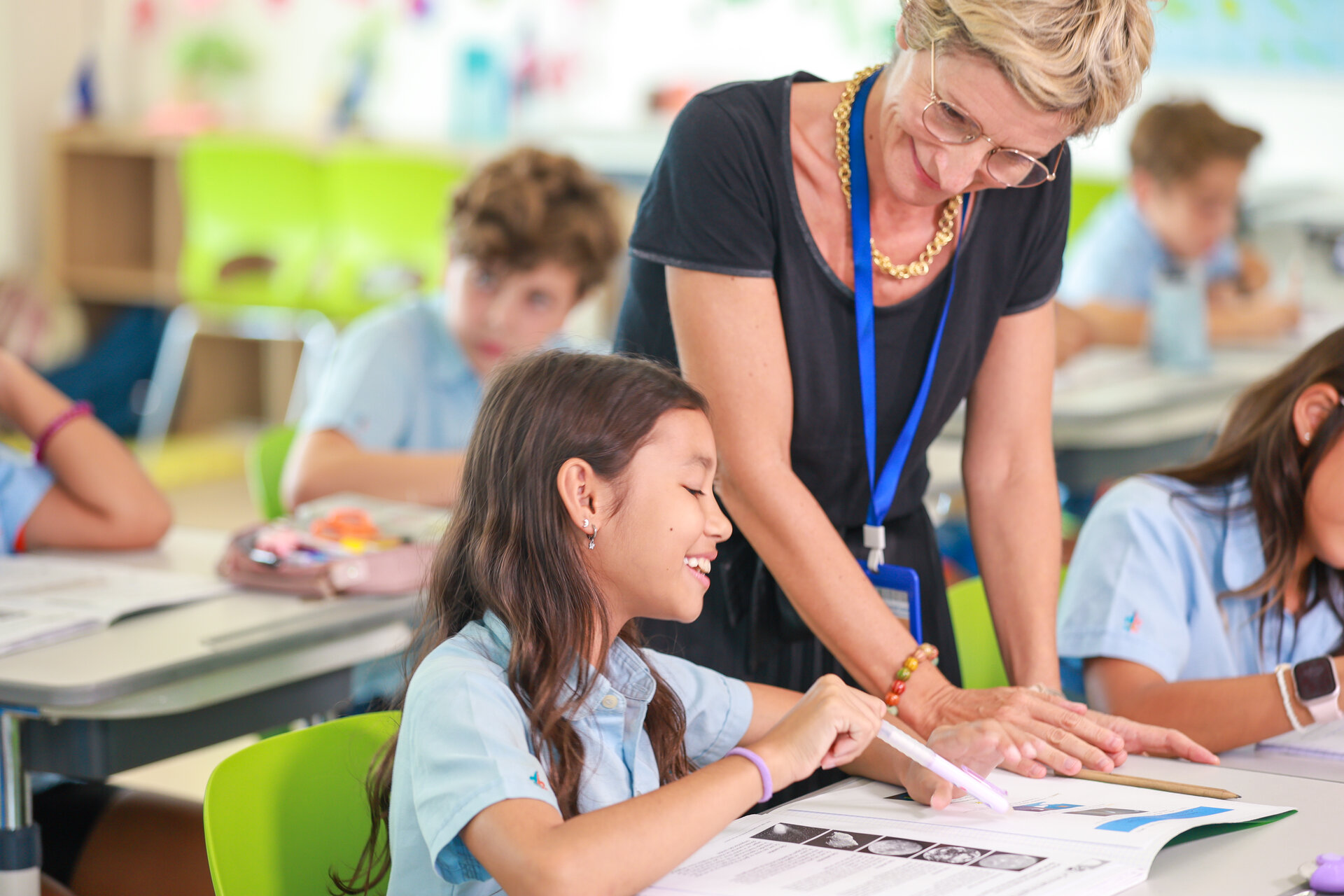 student reading with the teacher