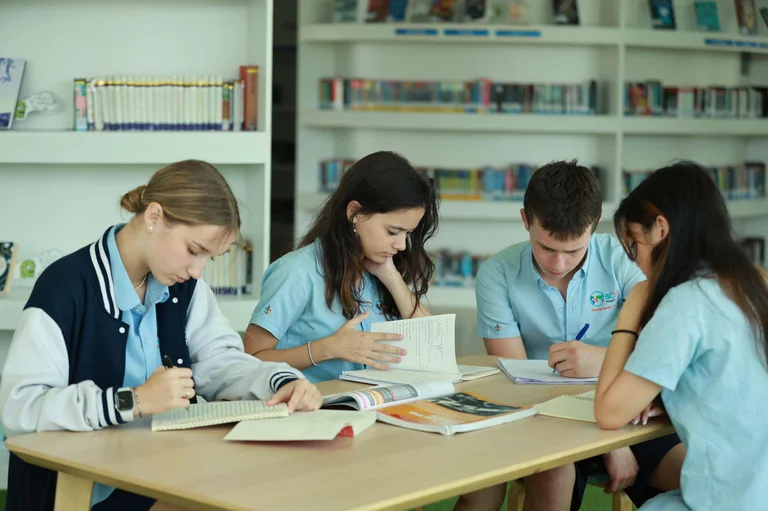 four students reading