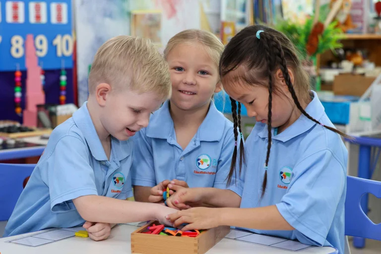 three students playing