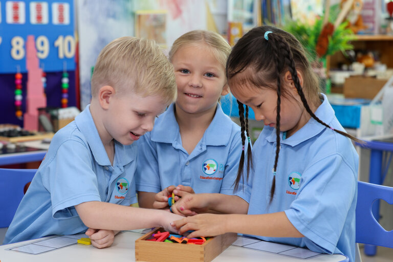 three students playing