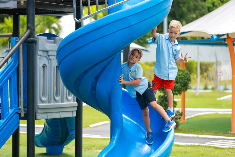 students playing on the slide