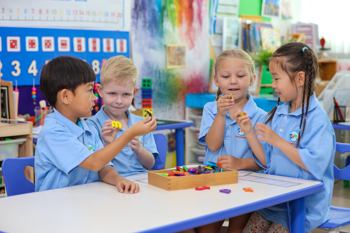 four students playing