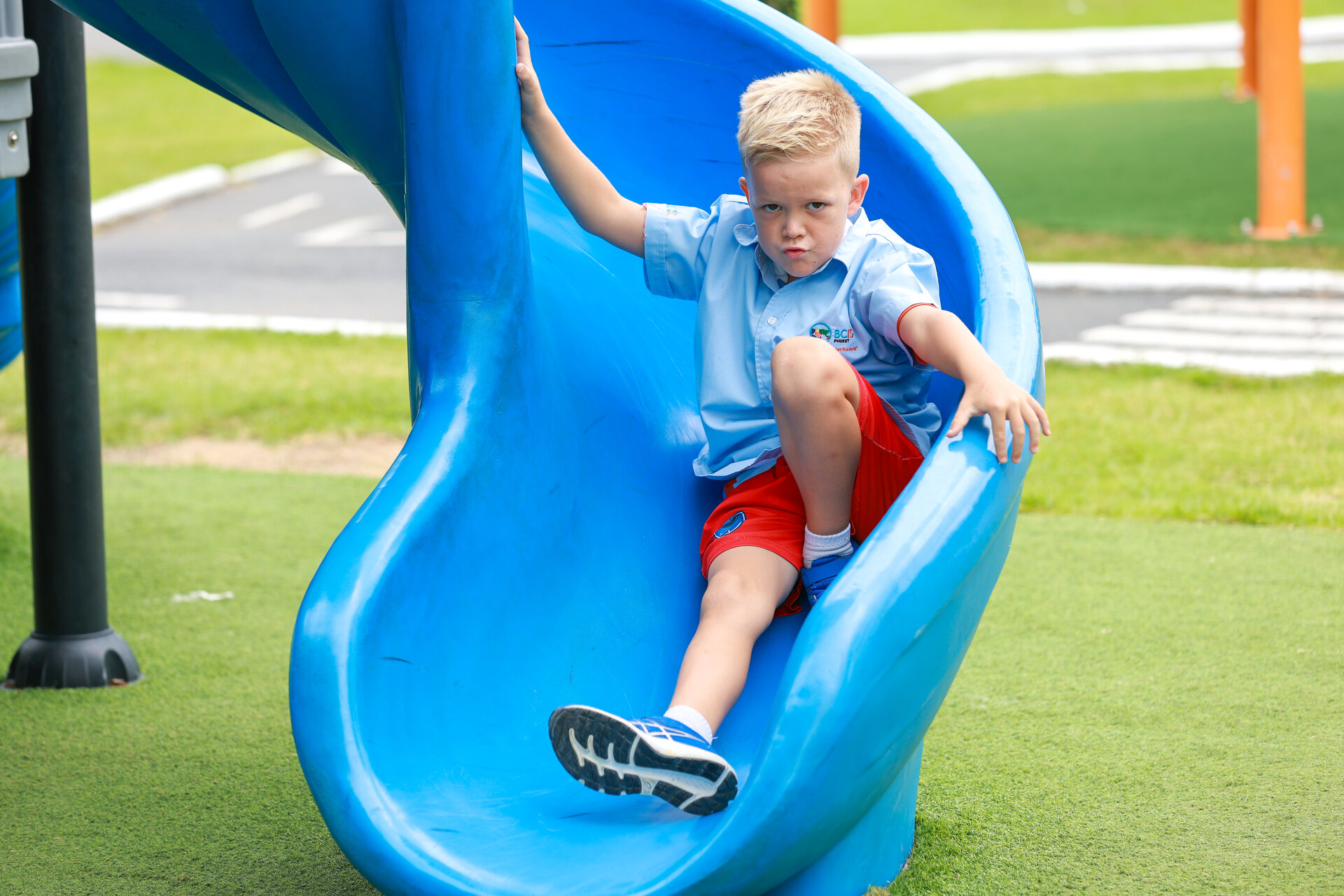 student playing on the slide