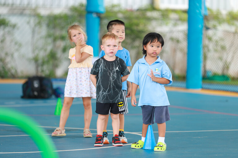 four students in the schoolyard
