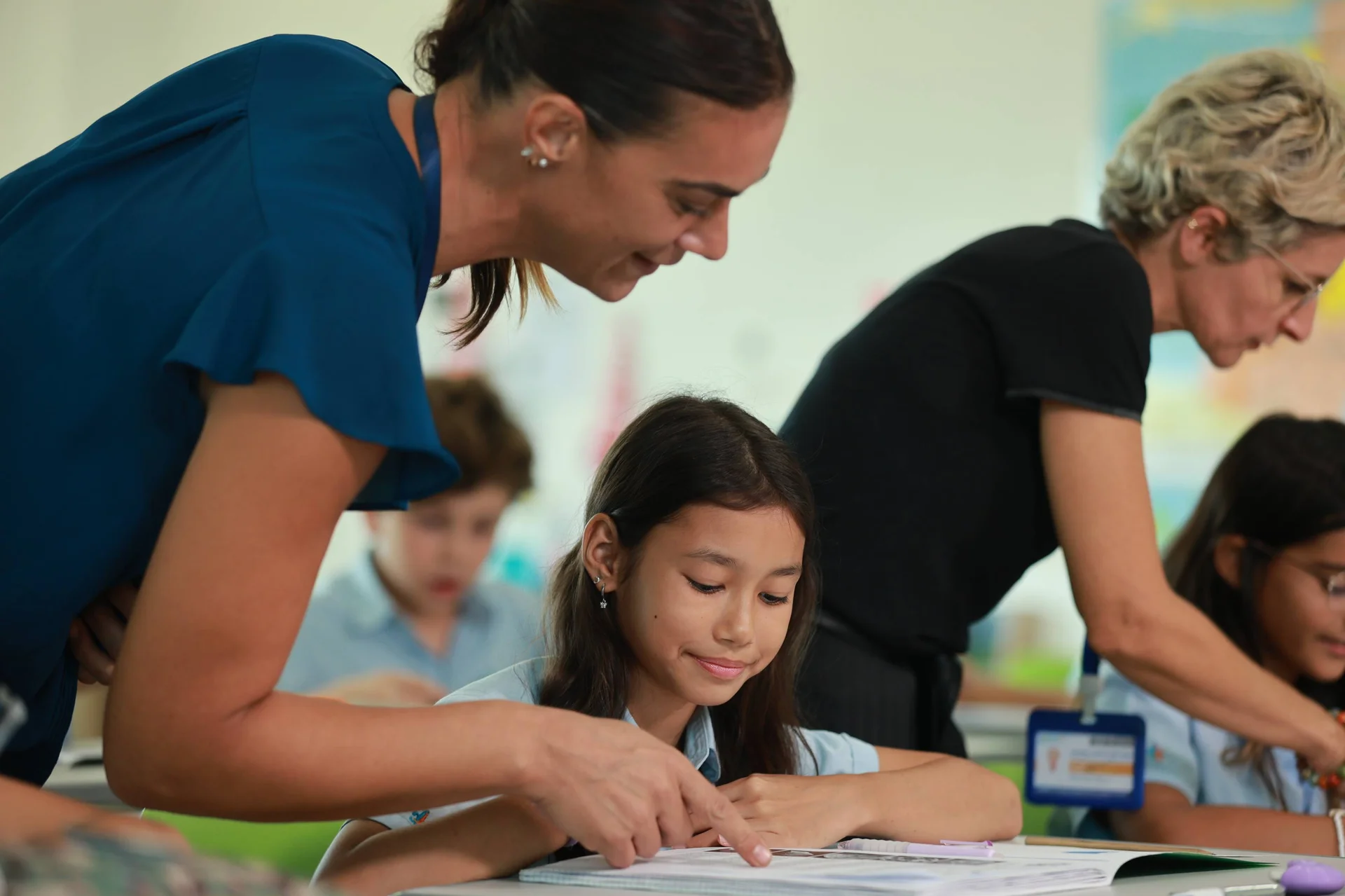 student reading with the teacher