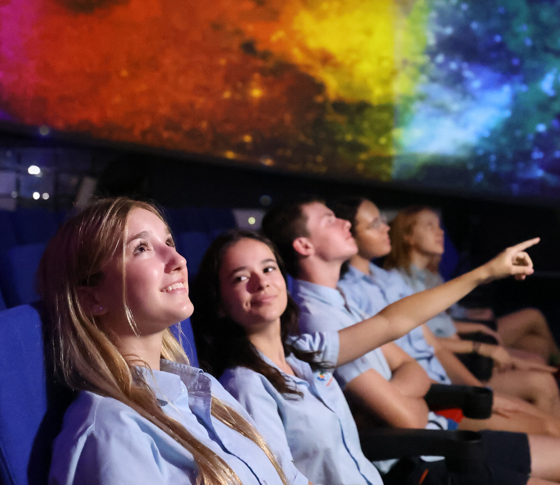 student under a coloured sky