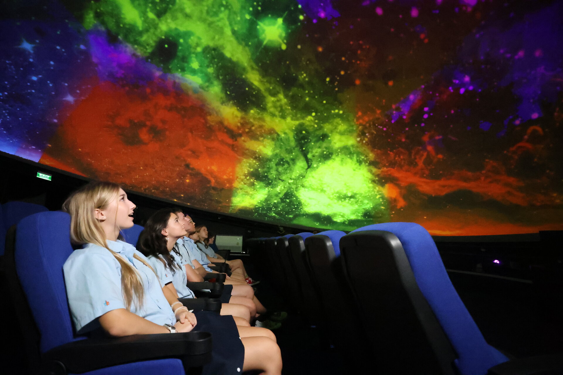 students under a coloured sky