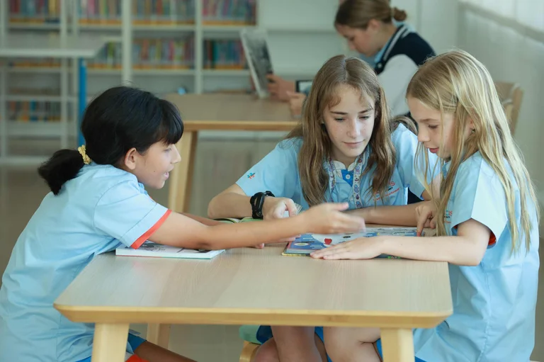 three students talking