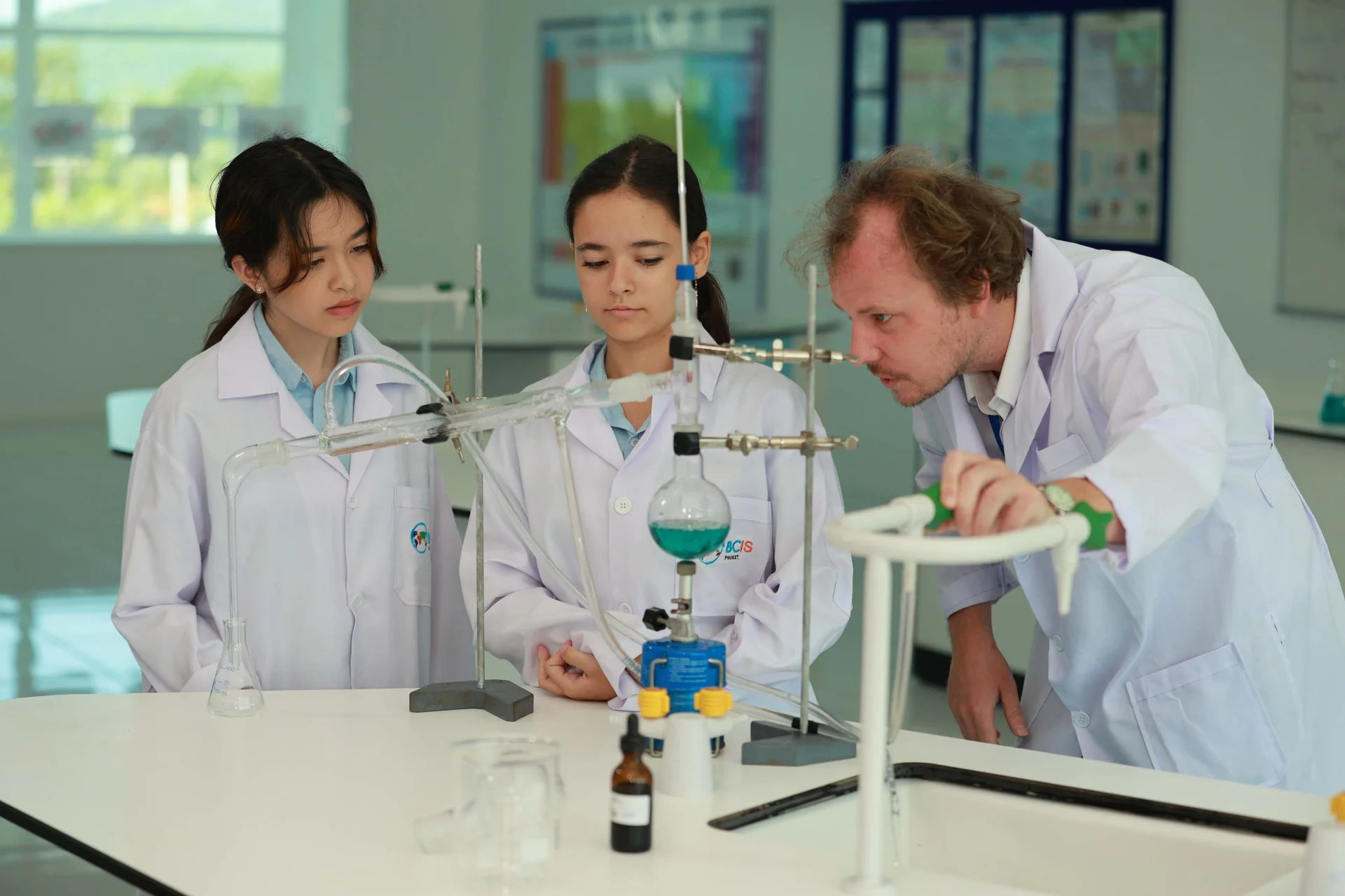 teacher and students during chemistry class