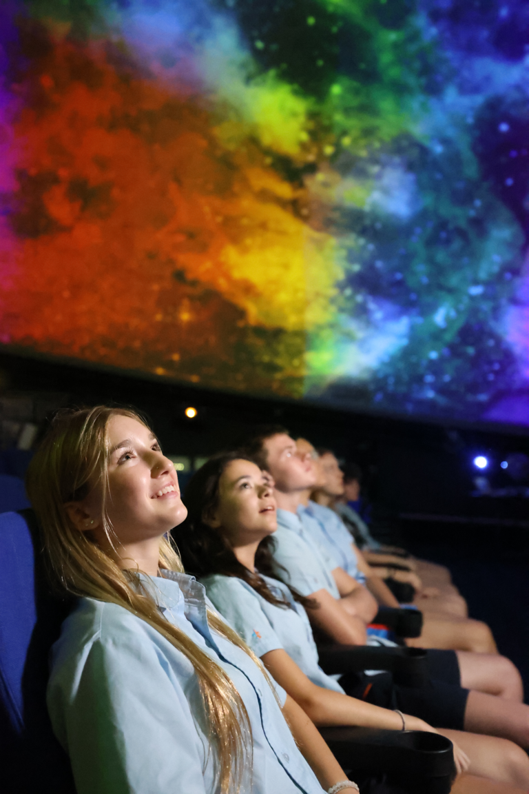 students under a coloured sky
