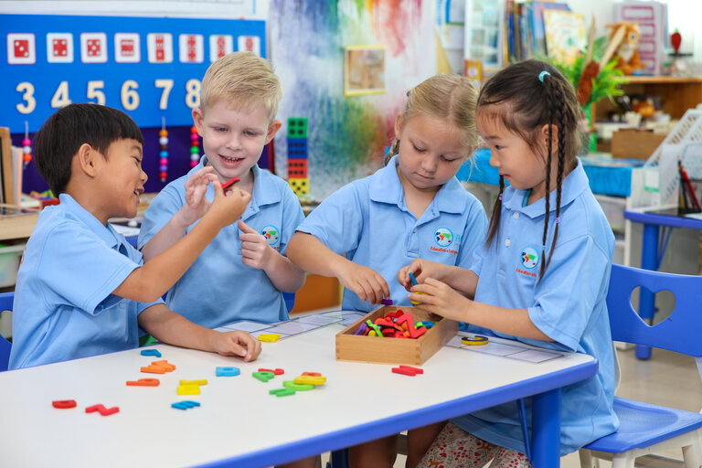 four students playing