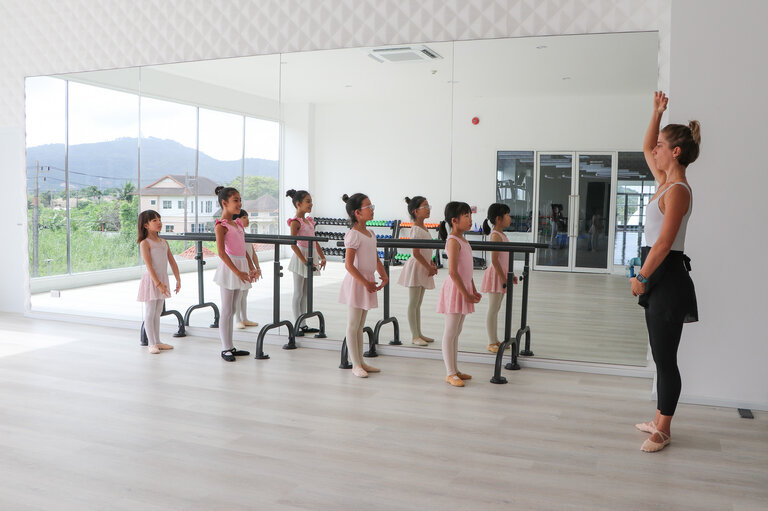 students and teacher during dance class